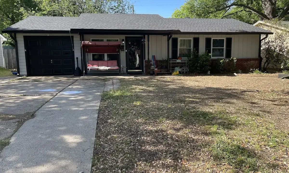 Asphalt Shingle Roof Repair crew at work on a residential roof in Spring